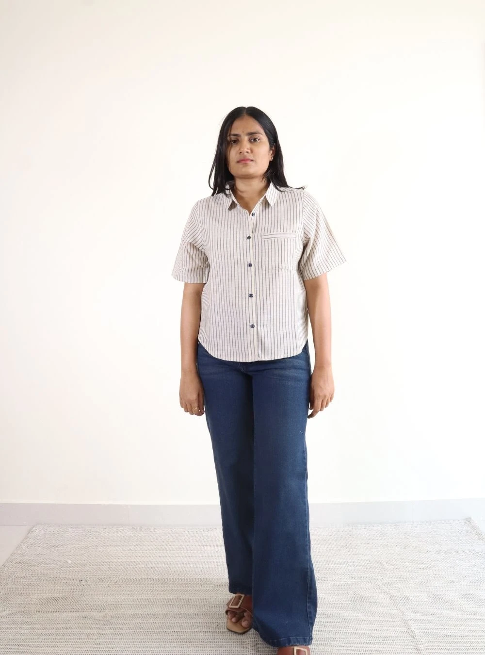 cream coloured striped mid length shirt