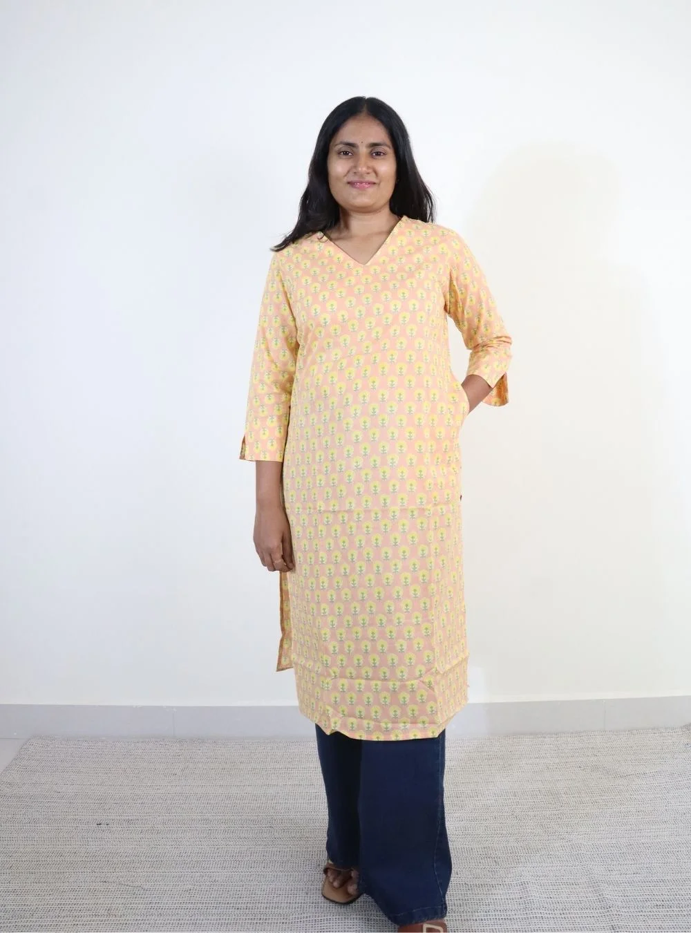 light orange coloured floral print cotton kurti