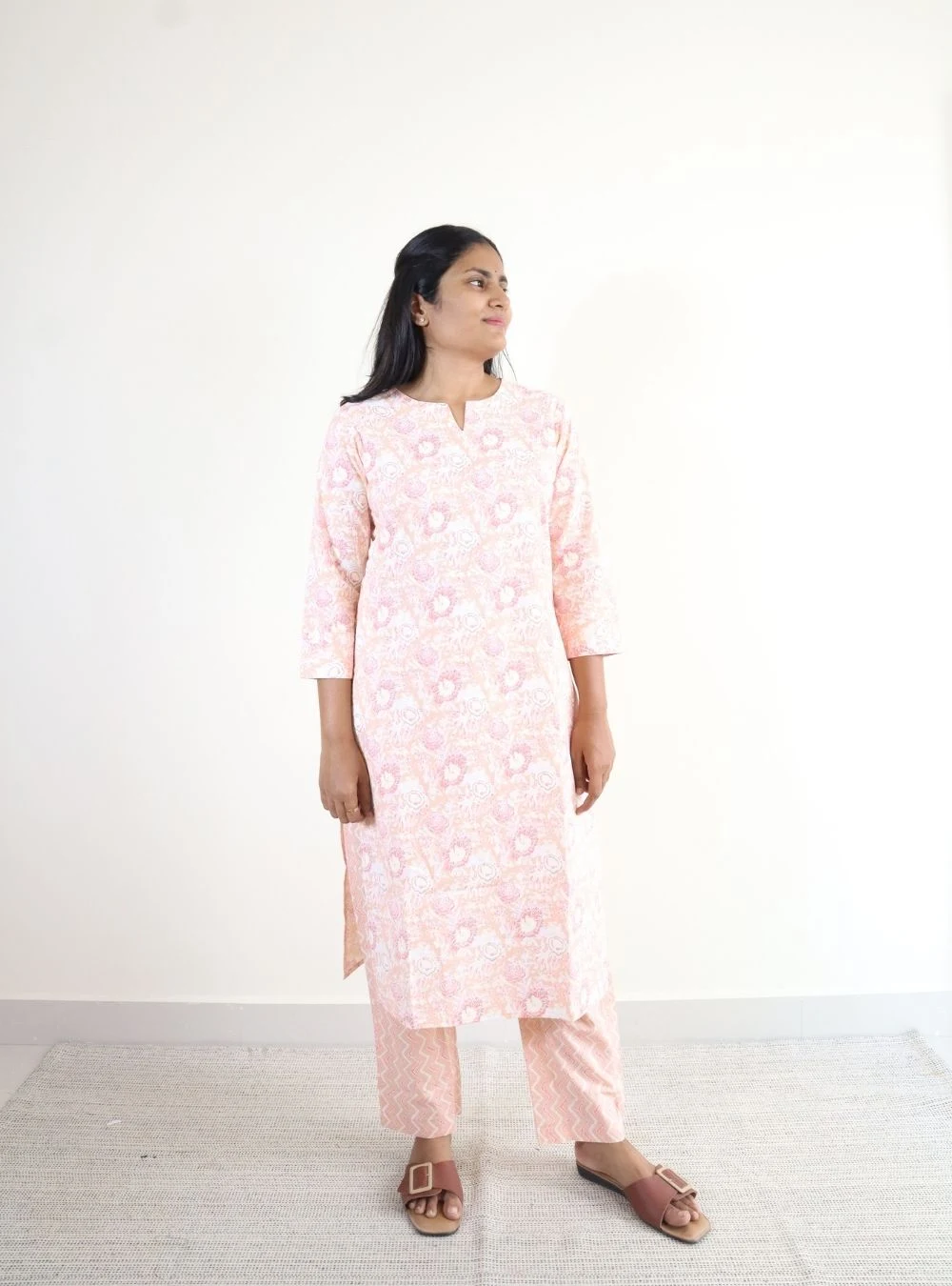 light peach coloured floral print kurta set