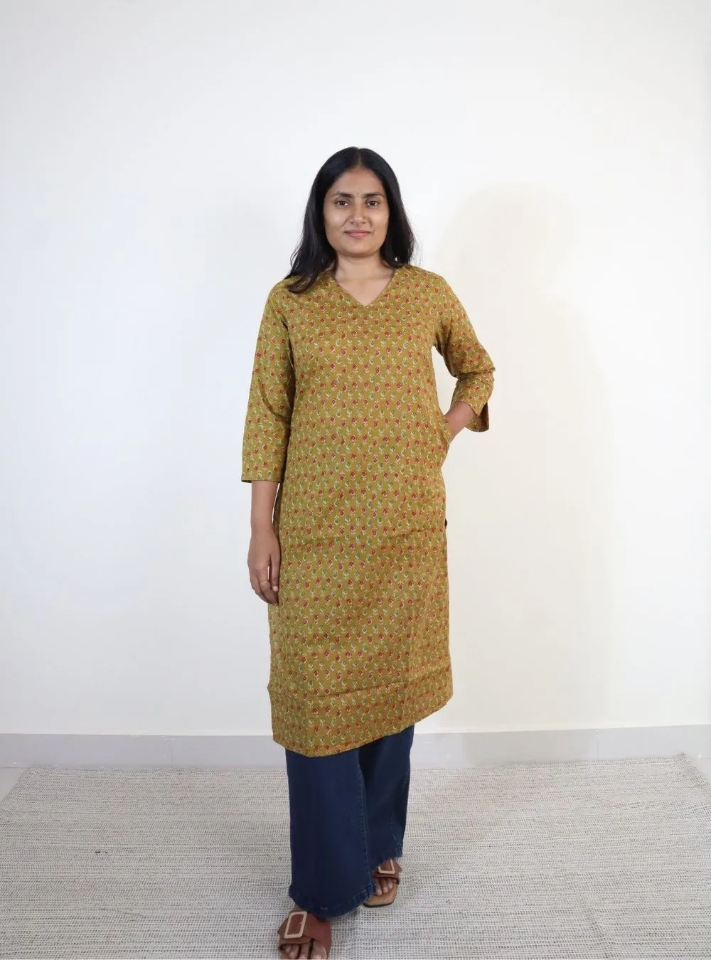mustard yellow coloured floral print cotton kurti