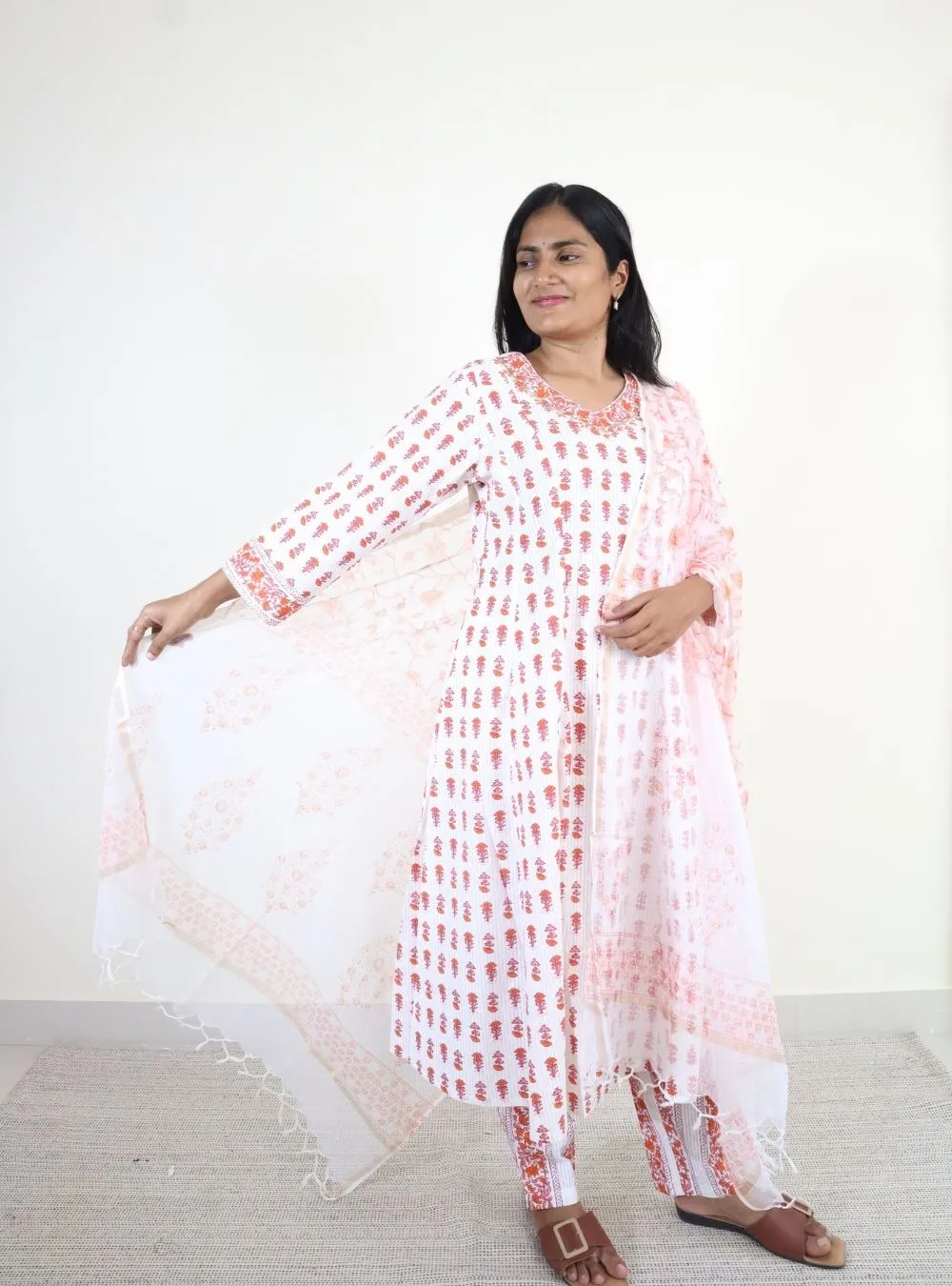 orange coloured floral anarkali kurta set
