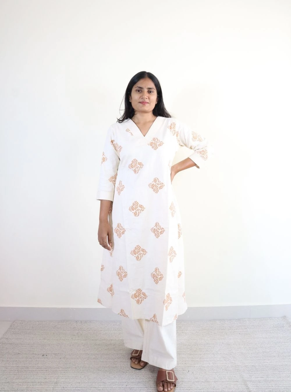orange coloured floral print kurta set